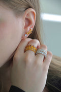 Model Wearing Golden Topaz Rings with earrings 