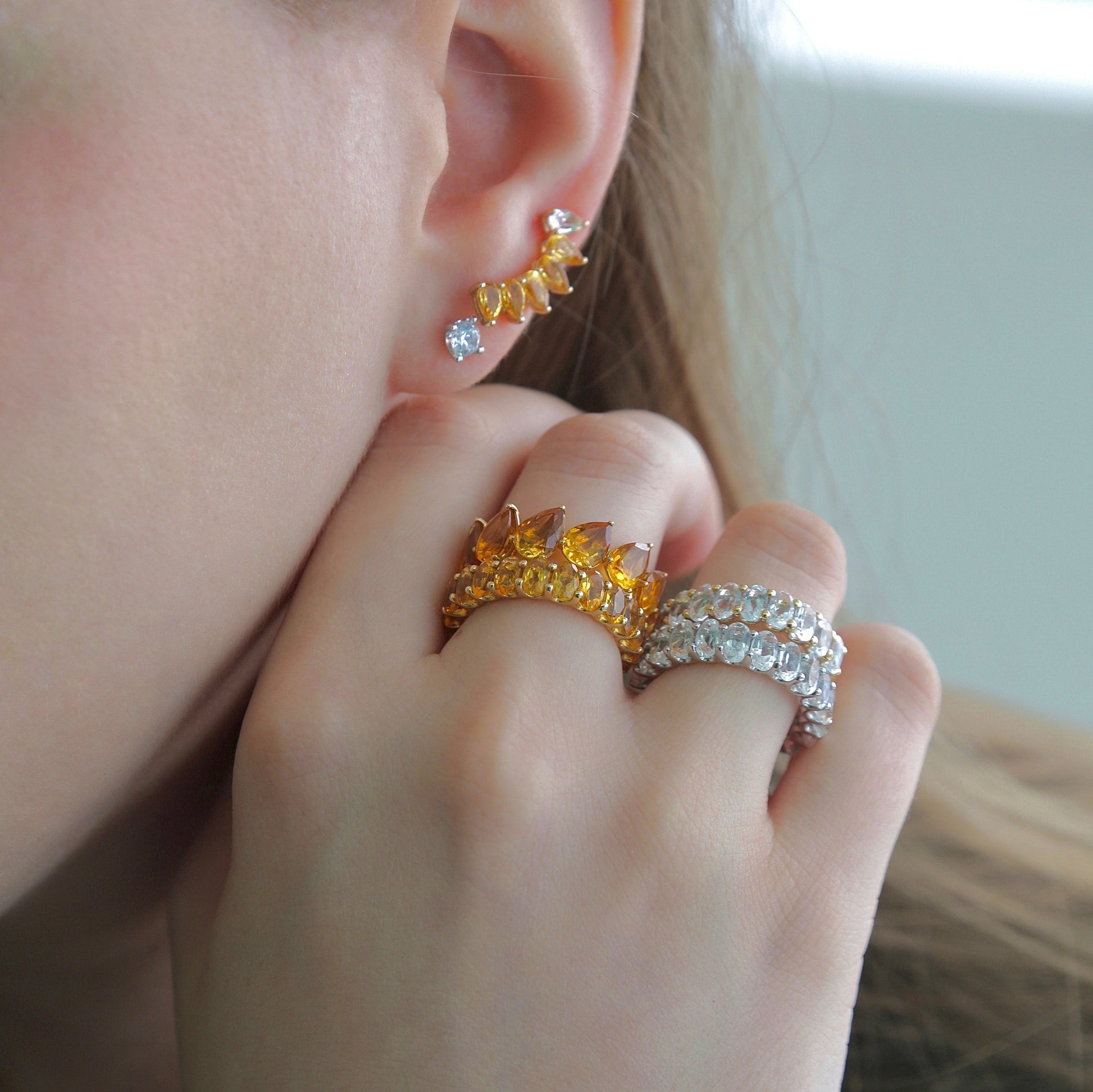 Model wearing Golden Topaz Ring with earrings